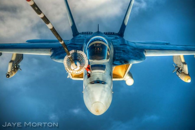 A F/A-18E Super Hornet refuels from a KC-10