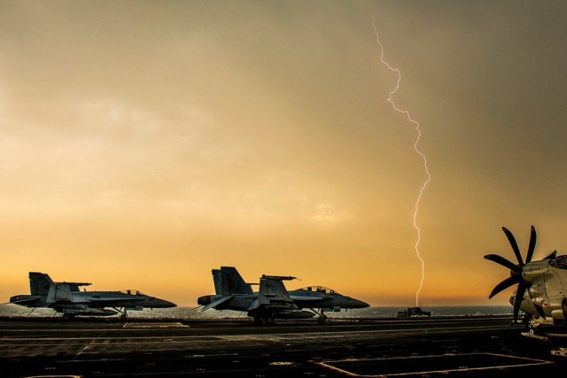 Lightning over the aircraft carrier 