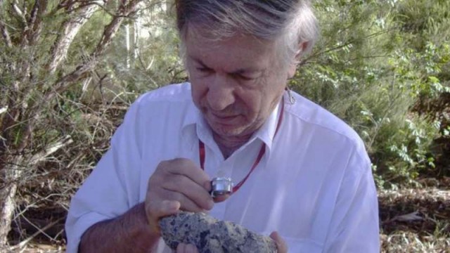 Dr Andrew Glikson with a sample of suevite