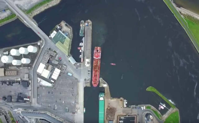 Aerial time-lapse of oil tanker entering a narrow port (1)