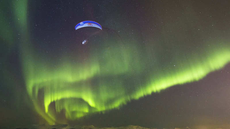 Paraglide Flight Through Aurora Borealis