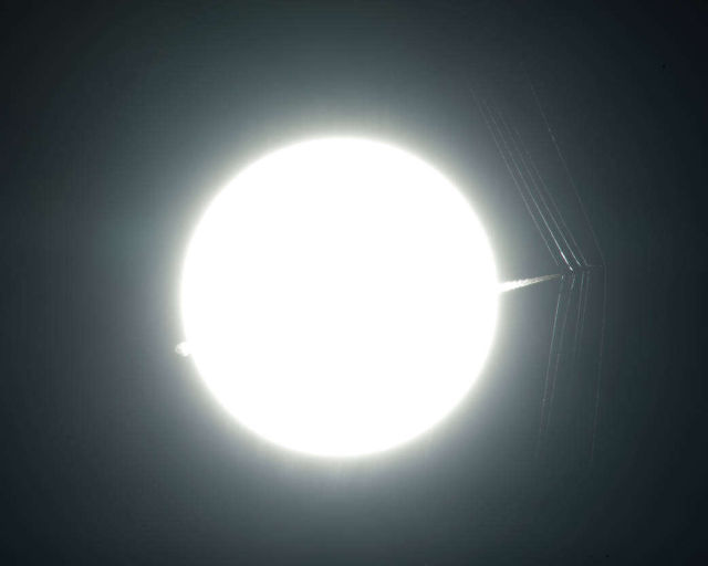 Aircraft passes in front of the Sun at Supersonic Speed
