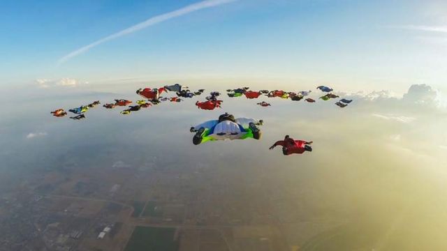 61 Wingsuiters Fly Together 