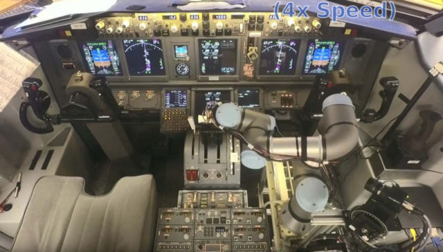 Watch how a Robotic Co Pilot flies and lands a simulated Boeing 737 1