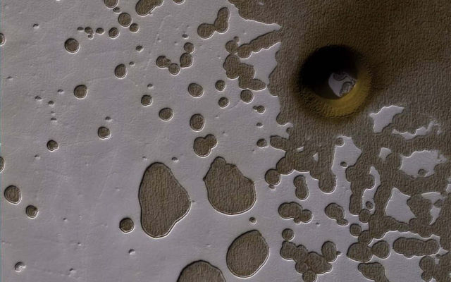A South Polar Pit or an Impact Crater on Mars