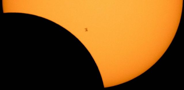 International Space Station in front of the Sun,s partial eclipse