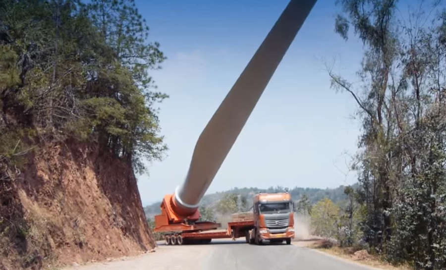 Trucks transporting giant Wind Turbine blades to the mountaintop
