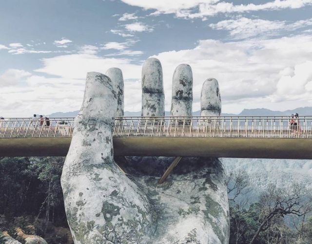 A giant pair of hands supporting a Bridge in Vietnam (2)