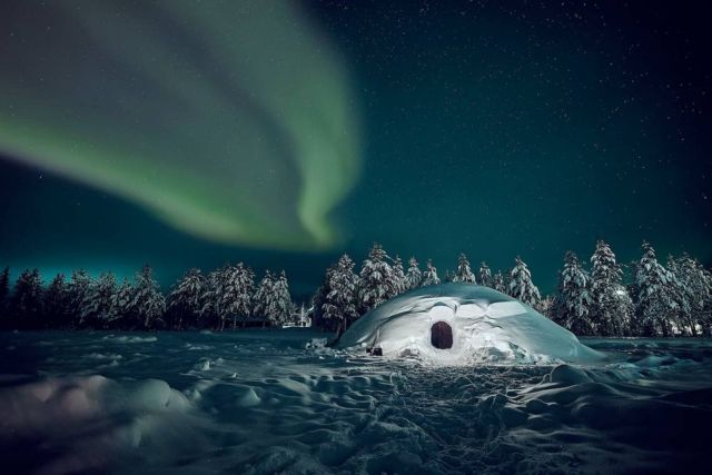 Snow Igloo under the Northern Lights