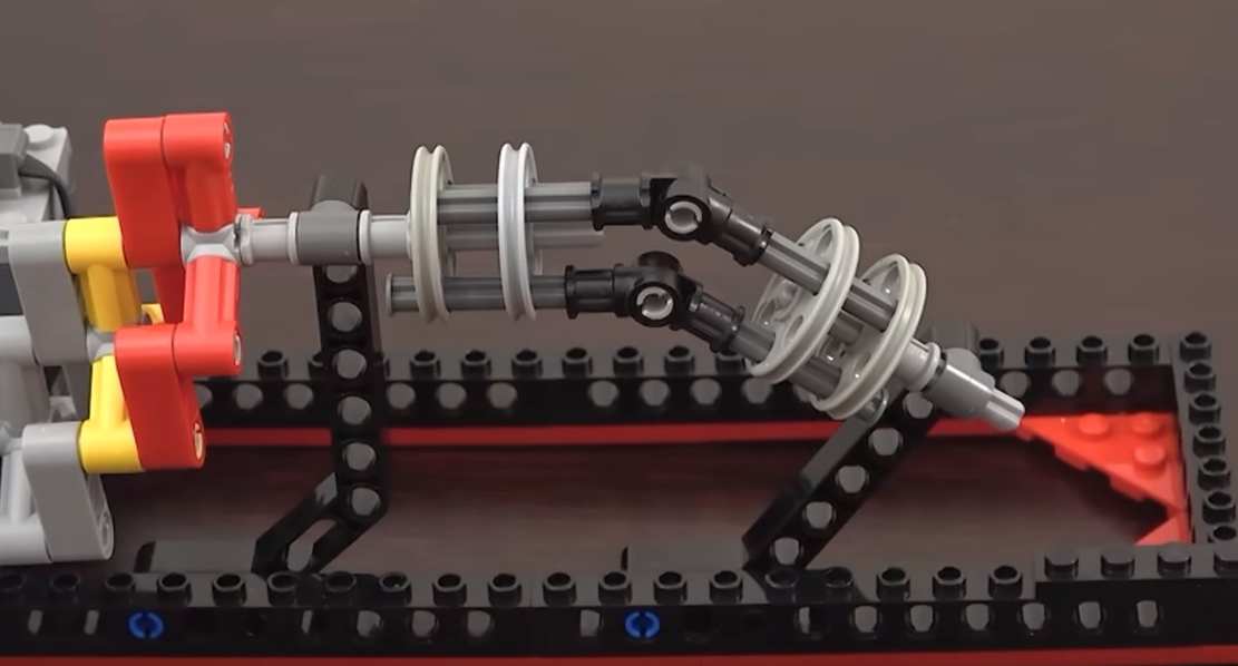20 Mechanical Principles combined in a Useless Lego Machine